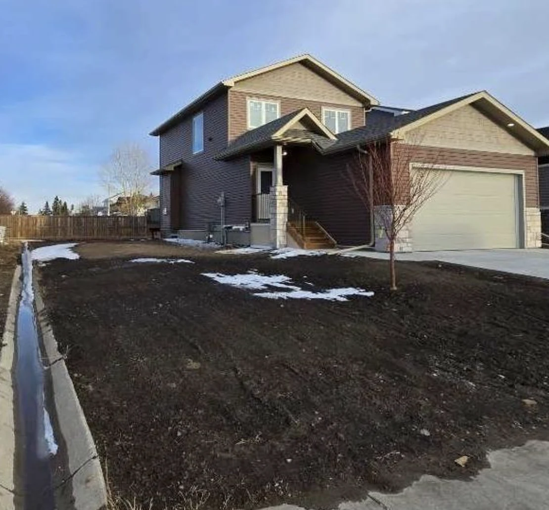 Attached double garage by CreekWest Custom Homes near Rocky View County, Alberta
