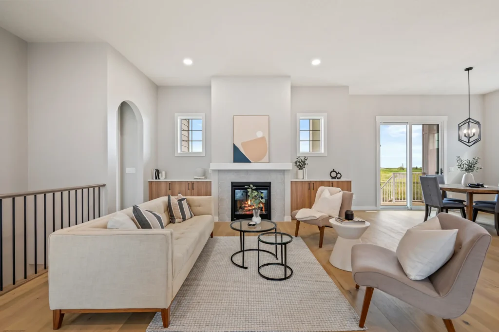 Living room fireplace by CreekWest Custom Homes near Kneehill County, Alberta