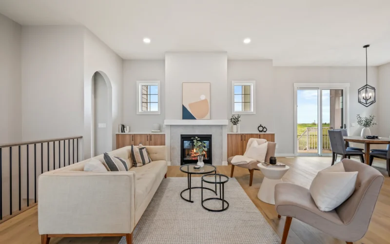 Living room fireplace by CreekWest Custom Homes near Kneehill County, Alberta