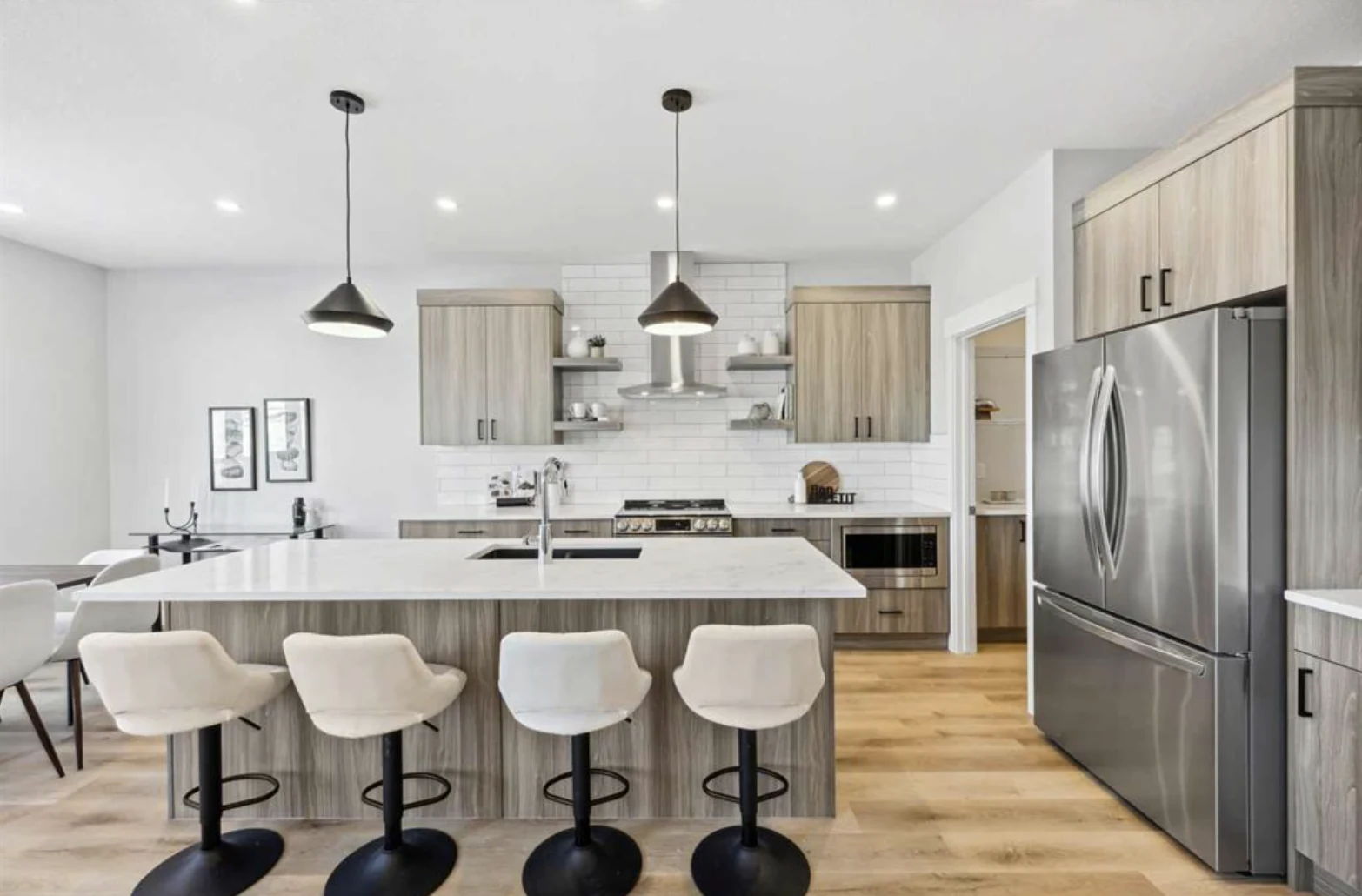 Quartz kitchen island by CreekWest Custom Homes near Wheatland County, Alberta